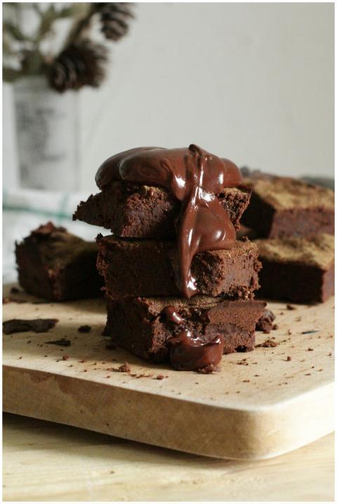 Delicious stack of chocolate brownies drizzled wit