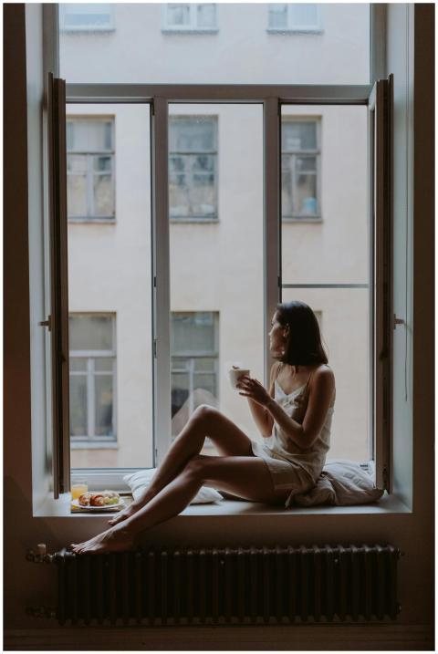 Woman enjoying a tranquil morning with coffee on a