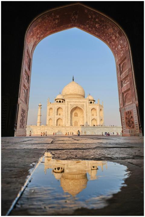 A stunning view of the Taj Mahal framed by an orna