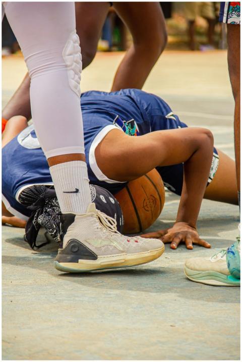 Dynamic close-up of players during an intense bask