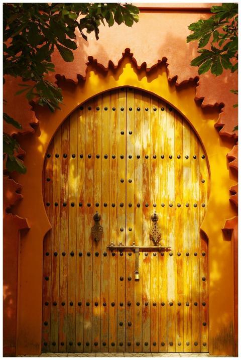 Traditional wooden gate with vibrant orange arches
