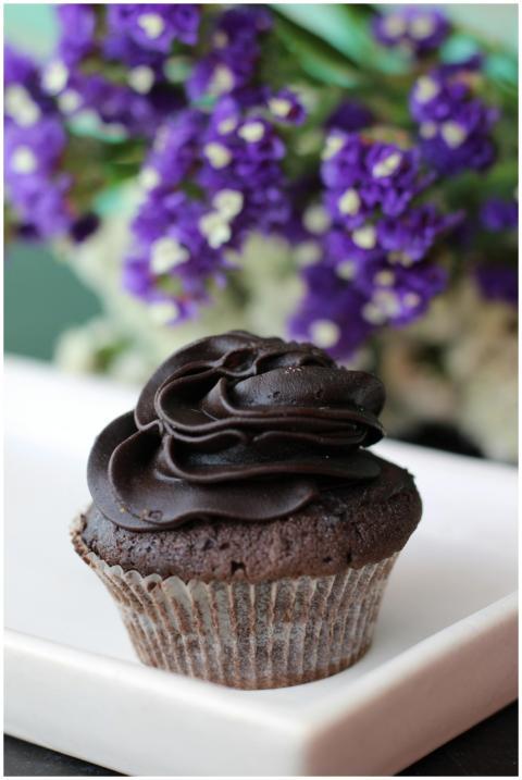 A rich chocolate cupcake topped with creamy icing