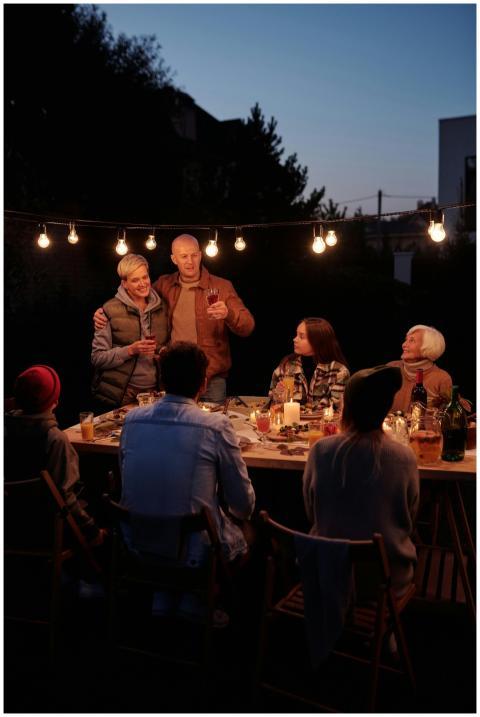 A warm family gathering during dusk, sharing dinne