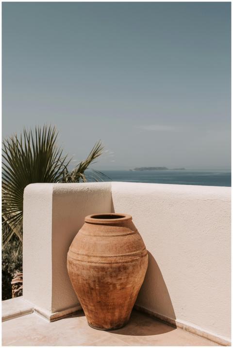 A serene Mediterranean terrace featuring a large c