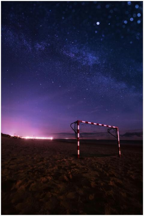 A mesmerizing night view of a soccer goal under a