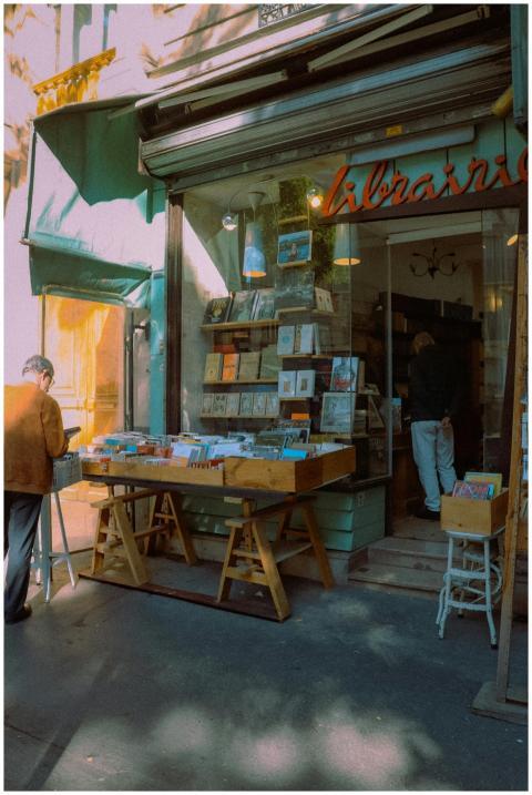 A quaint bookshop in Paris with books displayed ou