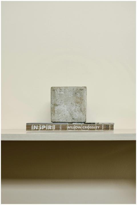 Serene Japandi-style shelf with stacked books and