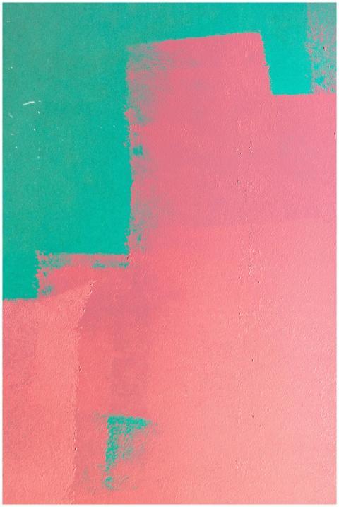 A vibrant abstract wall featuring pink and green p