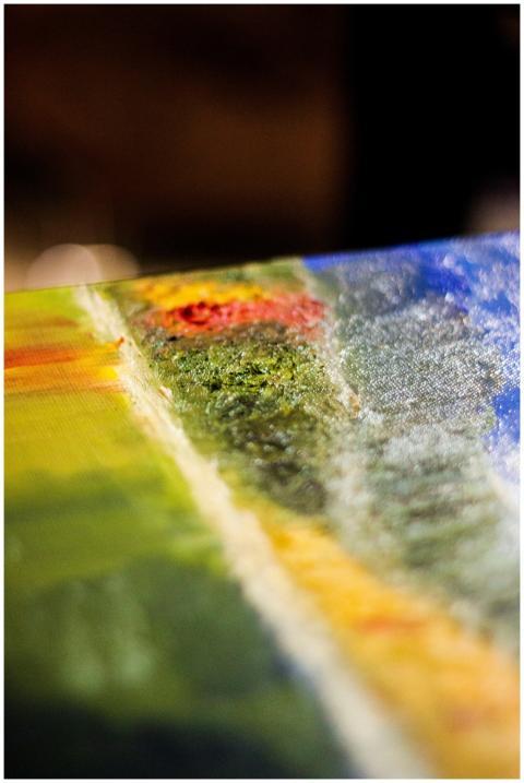 A detailed close-up of a colorful abstract paintin