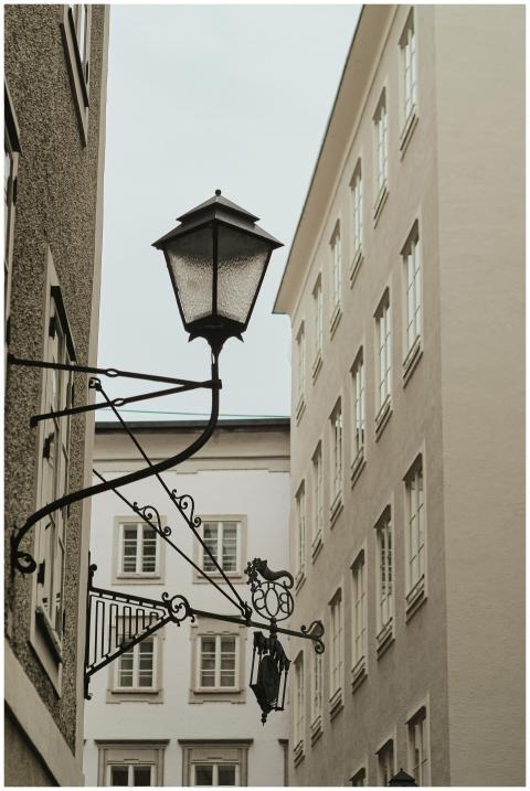 Elegant street lamp framed by traditional building