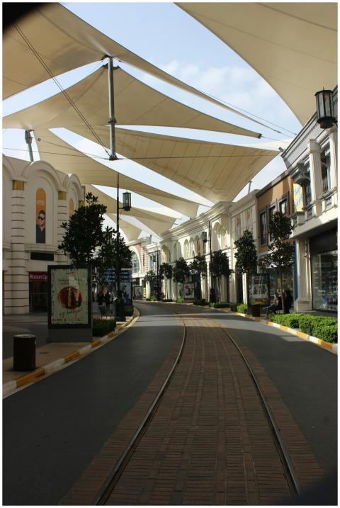 Spacious view of a modern shopping center with uni