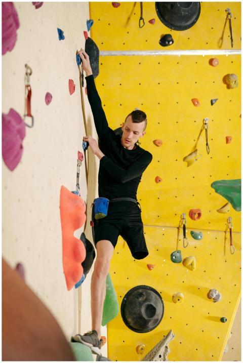 Determined man using prosthetic leg climbs an indo