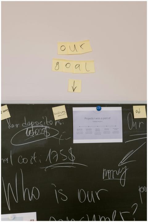 Office brainstorming session with sticky notes and