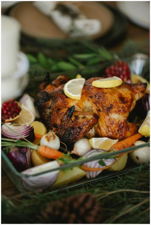 Delicious roast chicken surrounded by fresh vegeta