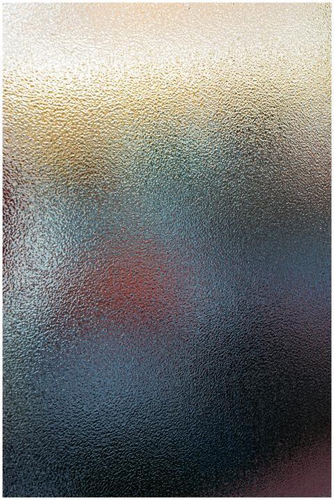 Defocused backdrop of translucent glass with spots