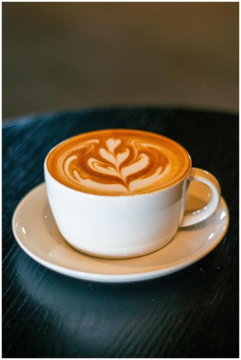 Cappuccino with beautiful froth art in a white cup