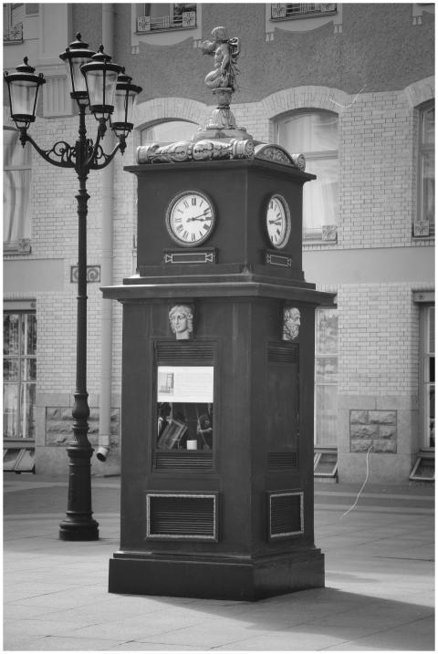 Black and white photo of a vintage clock tower in