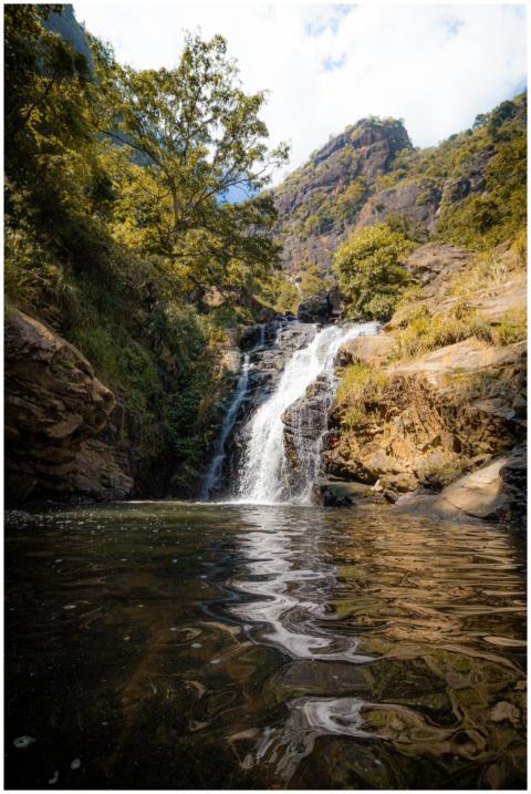 Explore the tranquility of a scenic waterfall amid