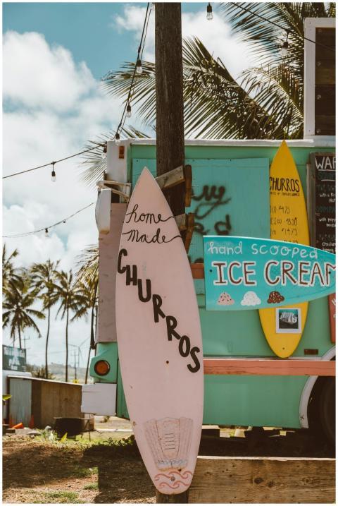 Colorful Hawaiian food truck with churros and ice