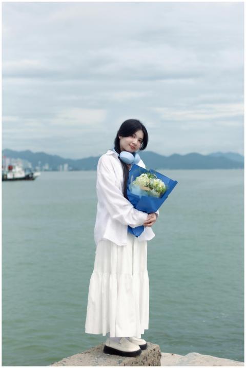 Young Woman Holding Flowers