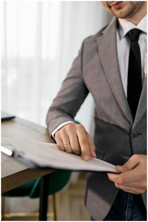 Business professional in suit reviewing important