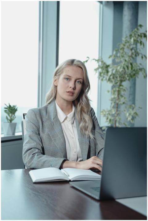 Portrait of a confident businesswoman working on h