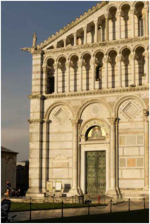 Sunlit facade of Pisa Cathedral in Tuscany, showca