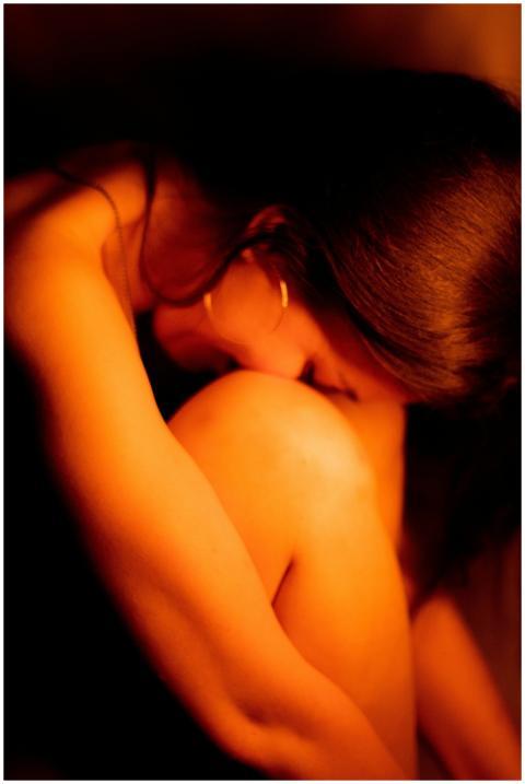 Artistic portrait of a woman in warm lighting, ref