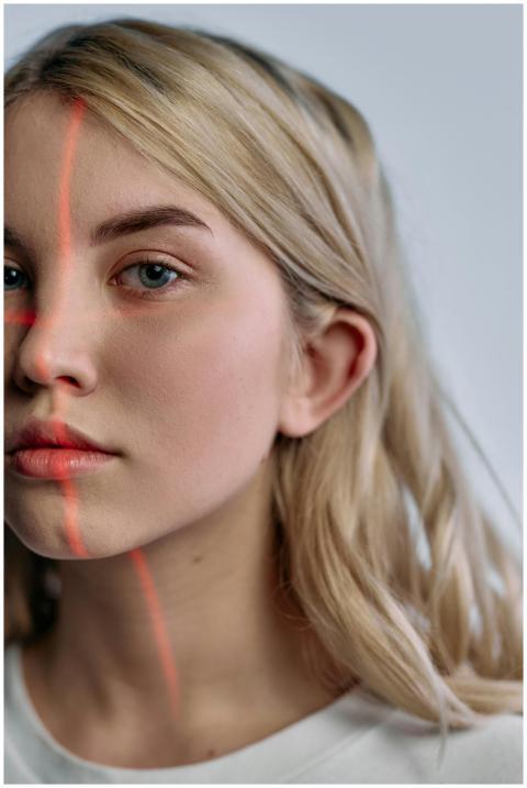 Close-up portrait of woman with laser scanning lin