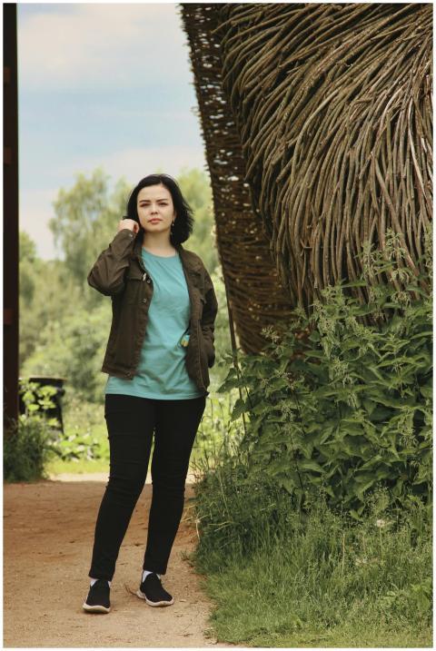 Casual portrait of a young woman outdoors in a rus