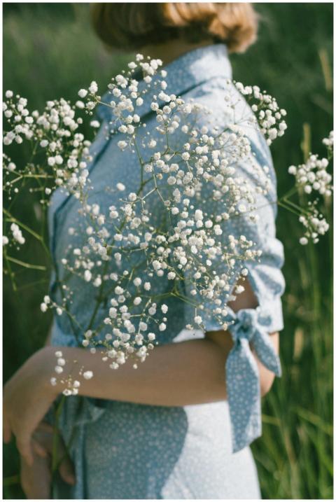 A serene moment captured as a woman in a blue dres