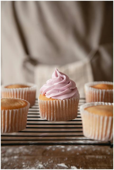A tempting display of vanilla cupcakes topped with