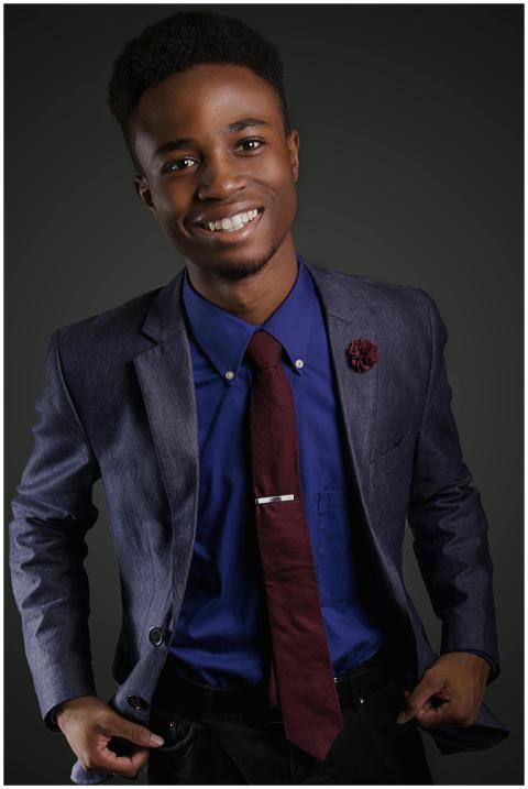 Portrait of a smiling young black man in a stylish