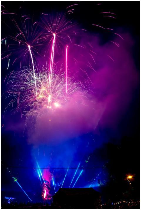 Colorful fireworks exploding in the night sky, cre