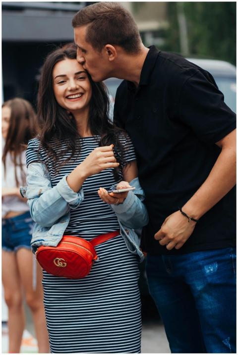 Smiling couple sharing an affectionate moment outd