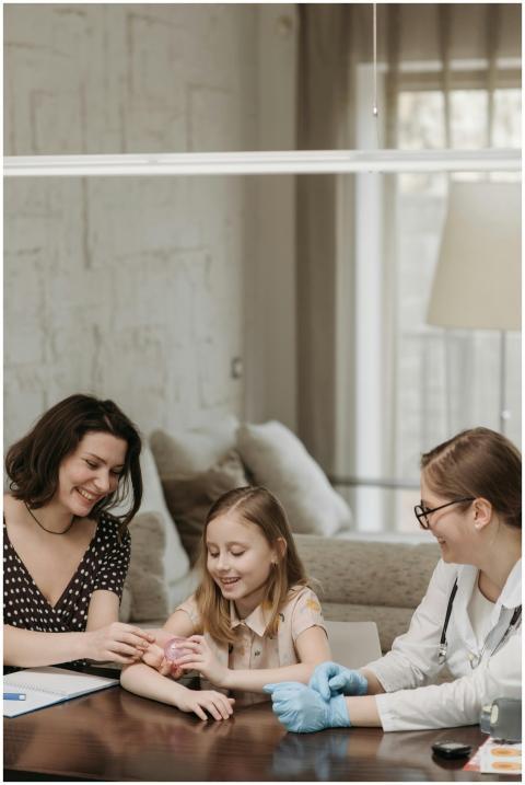 A doctor and mother caring for a child during a he