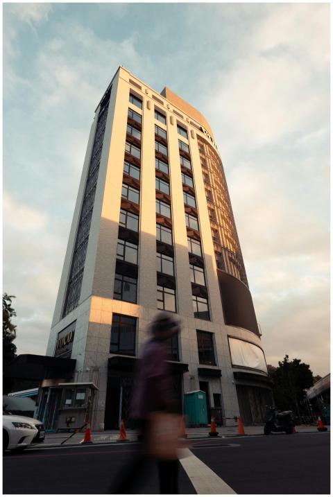 Street-level perspective of a modern building in T