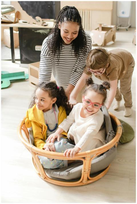 Happy preschool children playing together indoors