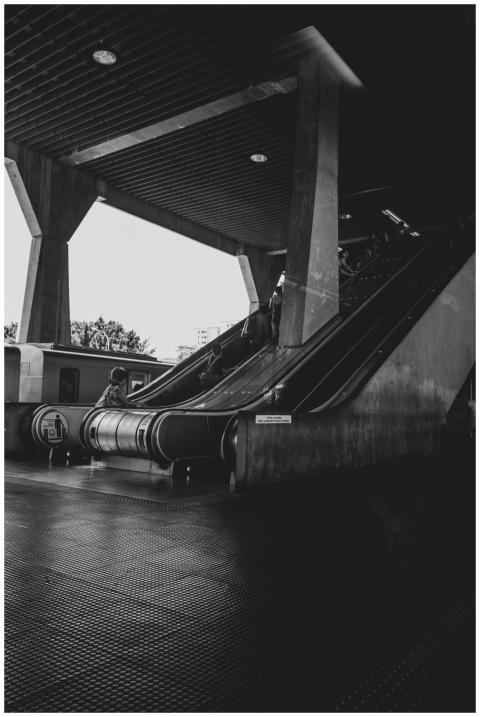 Monochrome photo of escalators in a São Paulo metr
