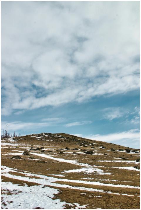 A tranquil landscape showcasing a snow-covered hil