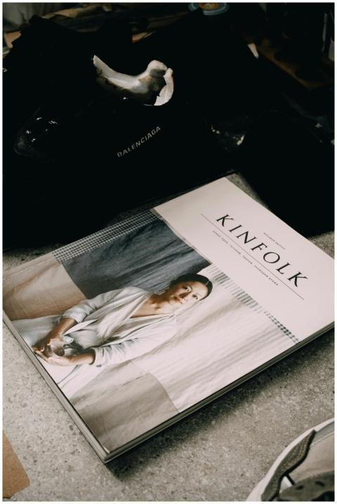 A fashionable setup featuring a Kinfolk magazine a
