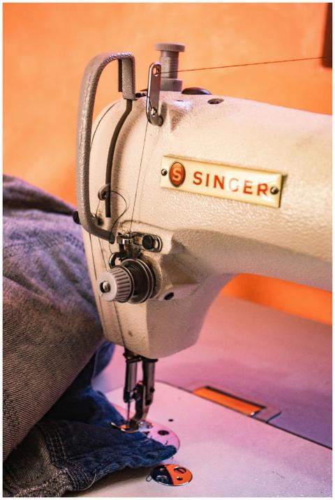 Detailed view of a Singer sewing machine working o