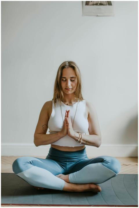 A serene image of a woman practicing meditation in