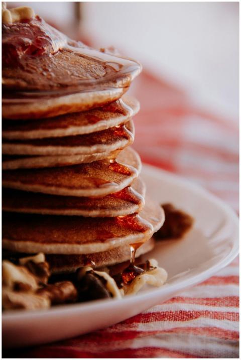 Delicious stack of pancakes drizzled with syrup an