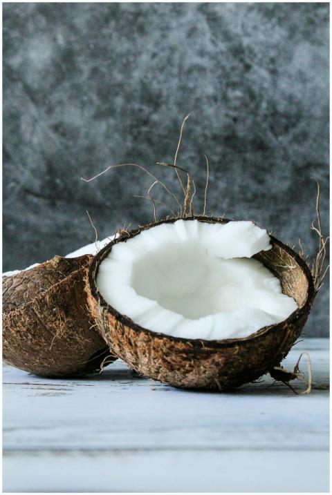 Close-up of a fresh halved coconut with its white