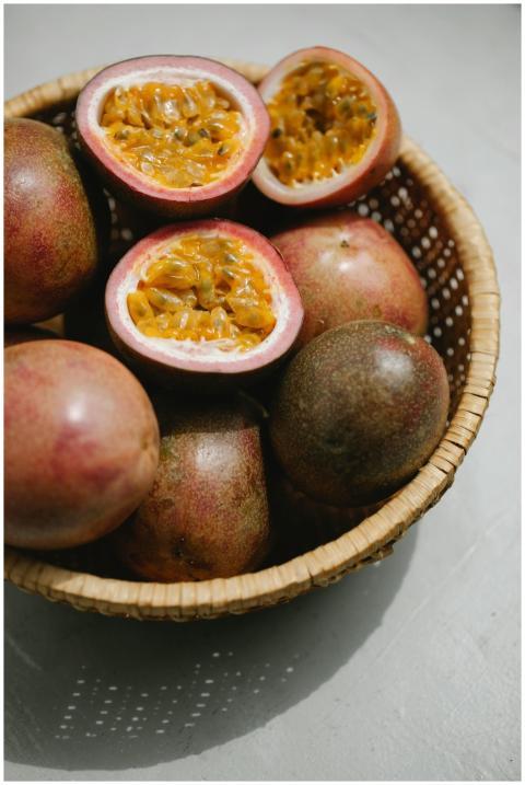 Close-up of ripe passion fruits in a wicker basket