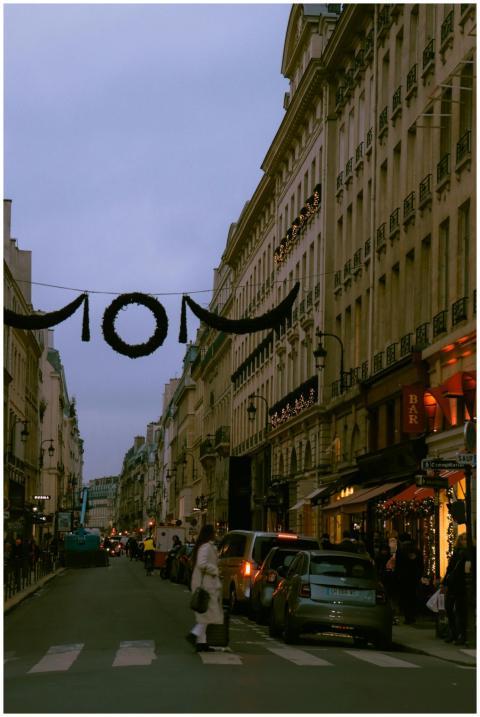 A bustling street scene in Paris at dusk, showcasi