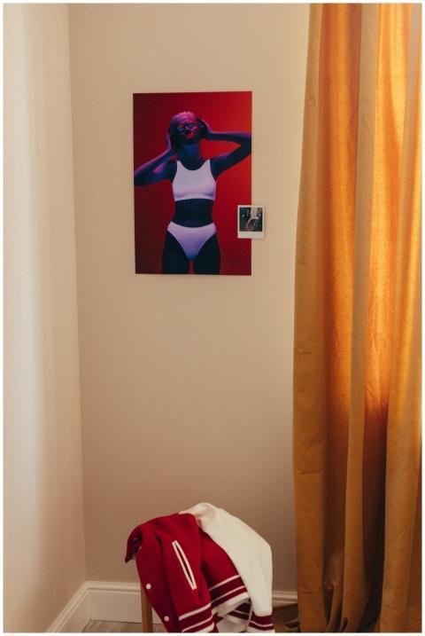 A modern room corner with a vibrant art piece and