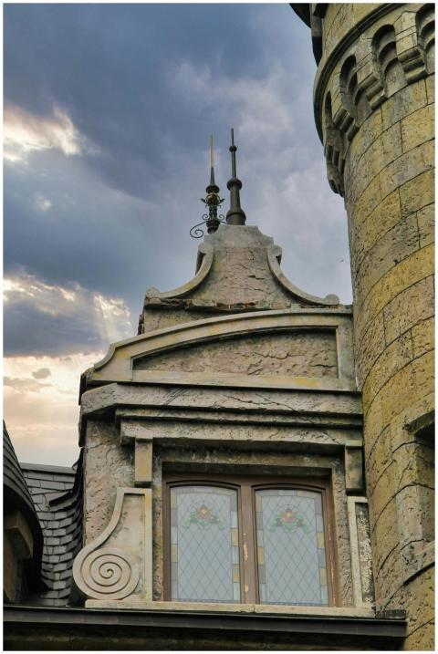 Close-up of a vintage castle turret with intricate