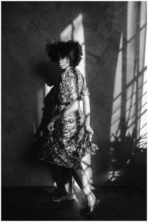 Stylish portrait of a woman in patterned dress cas